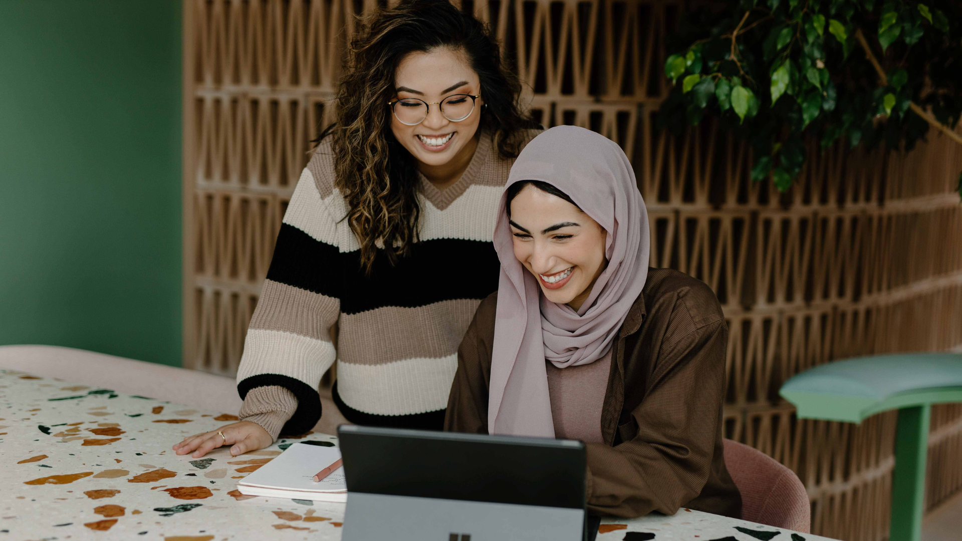 two female accountants are discussing in the office